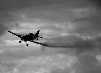 Low angle view of airplane flying in sky