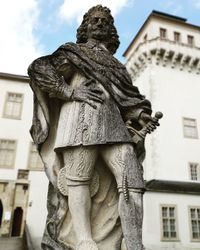 Low angle view of statue against building