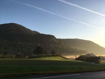 Scenic view of landscape and mountains against sky