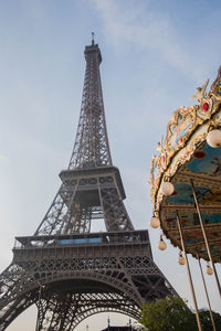 Low angle view of eiffel tower against sky during sunny day