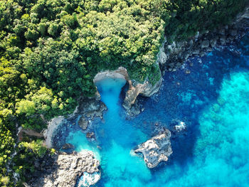 High angle view of water flowing through rocks