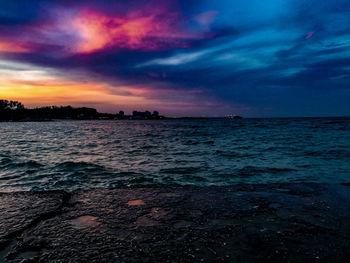 Scenic view of sea against dramatic sky