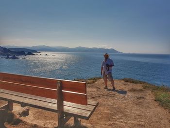 Full length of man standing by sea against sky