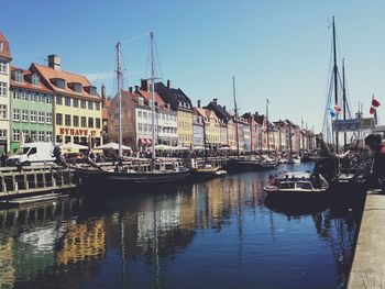 Boats moored at harbor