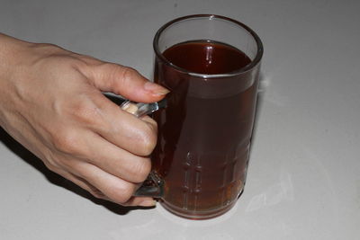 Close-up of man holding drink