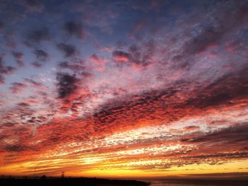 Low angle view of dramatic sky during sunset