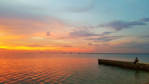 Scenic view of sea against sky during sunset