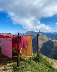 Clothes drying on clothesline against mountains