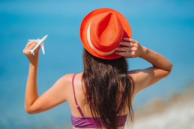 Rear view of woman wearing hat