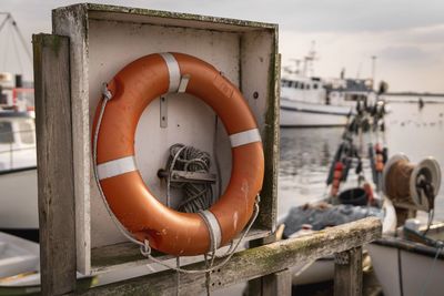 Life belt hanging in boat on sea