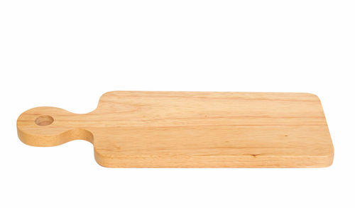 Close-up of bread on cutting board against white background