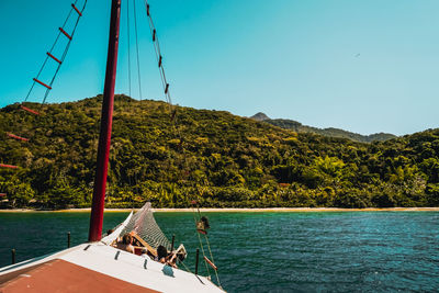 Scenic view of sea against clear blue sky