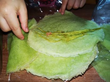 High angle view of person preparing food on table