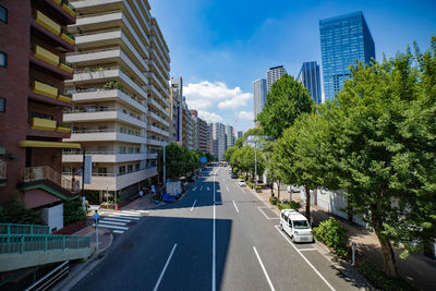 Road amidst buildings in city