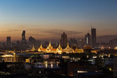 View of illuminated city at sunset