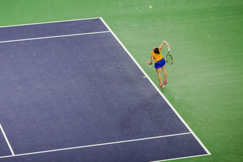 High angle view of woman playing tennis on court