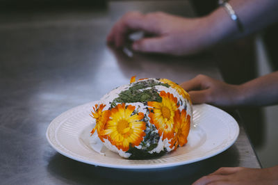 Close-up of food covered with flowers in plate