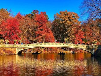 Arch bridge over river during autumn