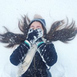 Portrait of smiling girl with snow