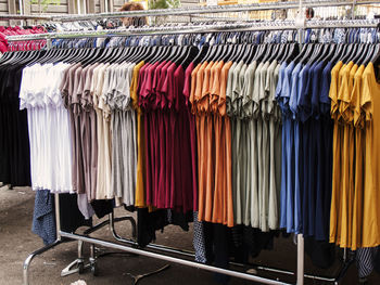 Row of multi colored t-shirts in store