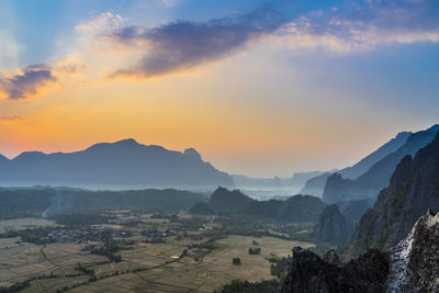 Scenic view of mountains against sky during sunset