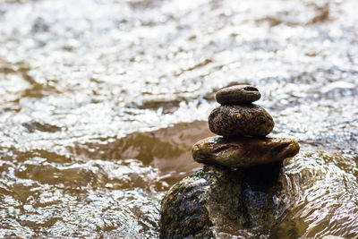 Close-up of stone stack on rock