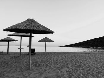 Lifeguard hut on beach against clear sky