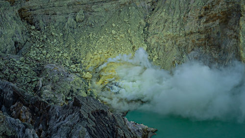 Smoke emitting from volcanic mountain