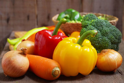 Close-up of tomatoes and vegetables on table