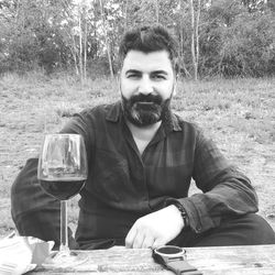 Portrait of young man sitting outdoors