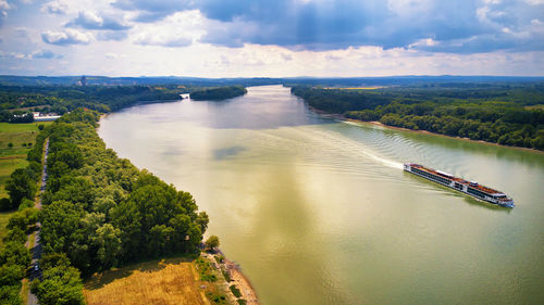 Tourist ship danube river budapest visegrad. summer vacations aerial view. sunny rainy mixed weather