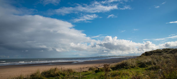 Scenic view of beach against sky