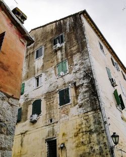 Low angle view of old building against sky