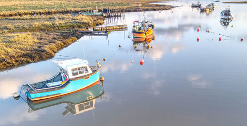 High angle view of fishing boats moored in lake