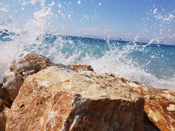 Waves splashing on rocks at shore