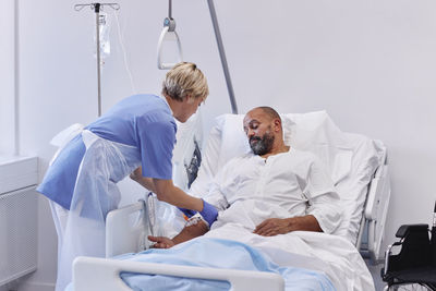 Nurse taking care of patient in hospital