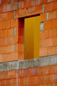 Low angle view of orange wall