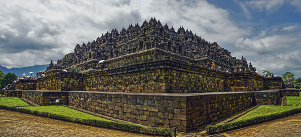 View of temple against cloudy sky