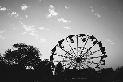 Low angle view of ferris wheel against sky