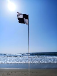 Lifeguard hut on beach against clear sky