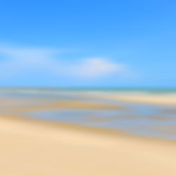 Scenic view of beach against blue sky