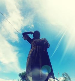 Low angle view of statue against sky