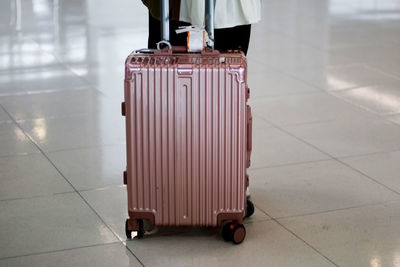 Low section of person on tiled floor