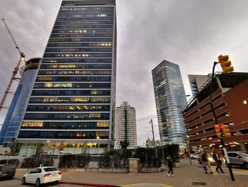 Modern buildings in city against sky