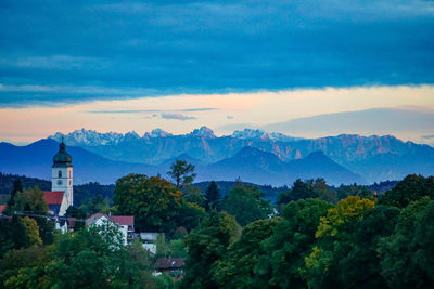 Scenic view of mountains and trees against sky