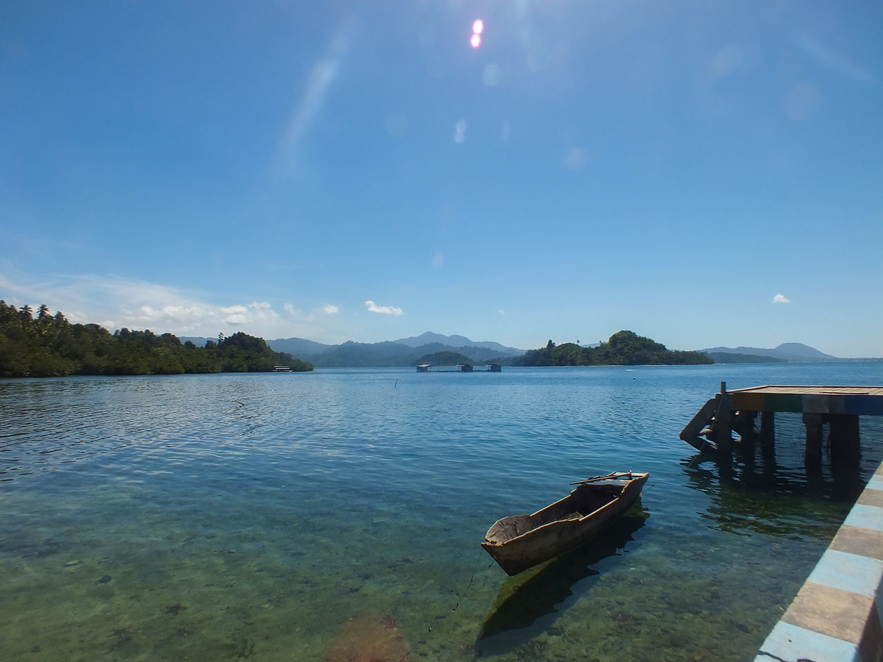 SCENIC VIEW OF LAKE BY MOUNTAINS AGAINST SKY