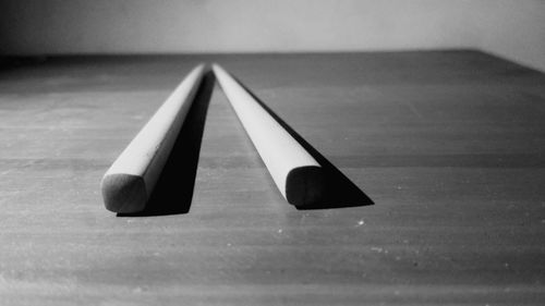 Close-up of pencils on wooden table