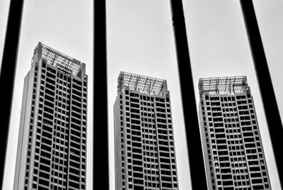 Low angle view of modern buildings against sky in city