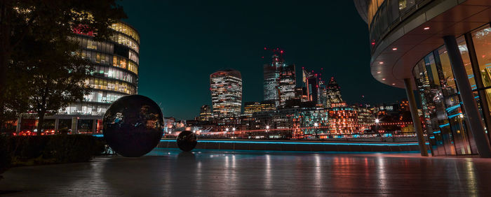 Illuminated buildings in city at night