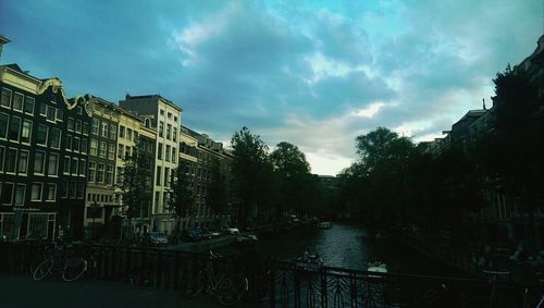 View of buildings against cloudy sky